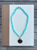 Turquoise Beaded Necklace with Tortoise Shell Charm