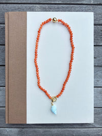 Orange Beaded Necklace with Blue Shell Charm