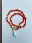 Orange Beaded Necklace with Blue Shell Charm