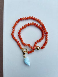 Orange Beaded Necklace with Blue Shell Charm