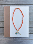 Orange Beaded Necklace with Turquoise Charms